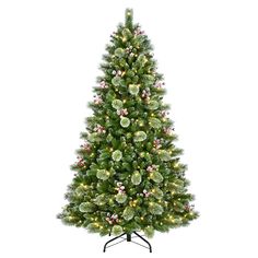 a christmas tree with lights and decorations on it's base, in front of a white background