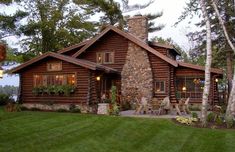 a log cabin with an outdoor dining area