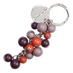 a key chain with beads and charms on it