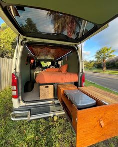 the back end of a van with its bed open