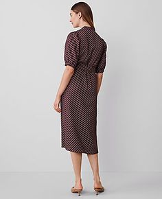 Elevate your wardrobe with the Ann Taylor Dotted Stand Collar Belted Midi Shirtdress, a piece that marries sophistication with comfort. This elegant dress features a unique stand collar and a charming dot pattern, perfect for both office and social gatherings.

- **Size:** Regular - 2
- **Color:** Plum Rose
- **Material:** 100% Polyester
- **Length:** 30" from natural waist; hits at mid-calf
- **Sleeves:** Short sleeves with shirred caps
- **Closure:** Button front placket
- **Features:** Self-t Female Features, Calf Sleeve, Belted Midi Dress, Blazer And Skirt, Sleepwear & Loungewear, Rose Dress, Petite Fashion, Petite Dresses, Tie Belt