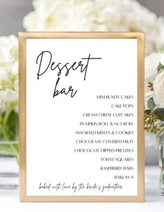 a sign that says dessert bar next to some flowers and vases with white roses