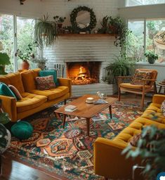 a living room with couches, chairs and a fire place in the fireplace area