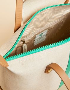 Mixing work & play? This Zip Travel Tote has it all. The zipper top opens to a compartment roomy enough for your laptop or tablet (for that client presentation), while the zip and 2 slip pockets organize your AirPods and sunblock for some podcast time by the pool. Made with an easy-to-wipe-clean, splash-proof, stain-resistant, laminated cotton and jute. On-the-go Pouch Backpack With Zipper Closure, Functional Bags With Zipper Closure For Weekend Trips, Functional Bag For Weekend Trips, On-the-go Laptop Sleeve Pouch Bag, On-the-go Satchel With Zipper Closure, Green Laptop Bag With Luggage Sleeve For Everyday Use, Green Laptop Bag With Luggage Sleeve, Beige Shoulder Bag With Zipper Pouch For Travel, On-the-go Pouch Travel Bag With Zipper Pocket