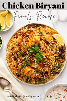 chicken biriyani family recipe on a plate with lemons and parsley