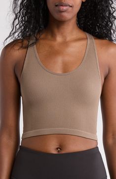 A ribbed texture distinguishes a longline bra with a seamless profile for easy layering whether lounging or heading to the gym. Scoop neck Sleeveless 91% nylon, 9% spandex Machine wash, tumble dry Imported Scoop Neck Seamless Crop Top For Yoga, Yoga Scoop Neck Seamless Crop Top, Seamless Medium Support Crop Top For Loungewear, Sports Ribbed Scoop Neck Sports Bra, Seamless Scoop Neck Crop Top For Gym, Sporty Ribbed Scoop Neck Sports Bra, High Stretch Ribbed Solid Sports Bra, Seamless Compressive Racerback Crop Top, Ribbed Scoop Neck Sports Bra In Athleisure Style