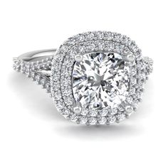 a cushion cut diamond ring with double halos