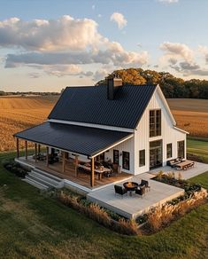 an aerial view of a house in the middle of a field