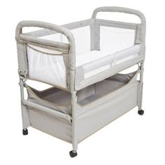 a baby crib with two drawers on it