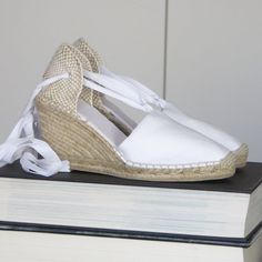 "Lace-up espadrille wedges in WHITE canvas, with ribbons in the same color and 9cm heels (3.54 inches). Handsewn with visible seam, following traditional techniques. Reinforced in the front with extra stitching. The rope soles are antislippery, covered with rubber. Hand - made in Spain with natural products - high quality. VEGAN SHOES, animal friendly & sustainable. In order to prevent the fraying of the ribbons, the ribbons end come glued, what makes a quite nice closing (see last pic for d White Closed Toe Wedge Sandals For Spring, White Closed Toe Espadrilles For Summer, White Espadrilles With Removable Insole For Summer, White Espadrille Wedge Sandals For Spring, Casual White Espadrille Wedge Sandals, White High Heel Espadrilles For Beach, White High Heel Espadrilles For Summer, White High Heel Espadrilles For Vacation, White High Heel Espadrilles For Spring