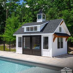 a small pool house next to a swimming pool