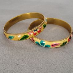 Set Of 2 Beautiful Hand Painted Floral Bangle Bracelets. 3" In Diameter Multicolor Hand Painted Bangle Jewelry, Hand Painted Multicolor Bangle Jewelry, Multicolor Hand Painted Bangle Bracelets, Multicolor Hand Painted Bangle Bracelet, Hand Painted Multicolor Bangle Bracelet, Handmade Multicolor Metal Bangle, Multicolor Hand Painted Bangle, Hand Painted Multicolor Bangle, Adjustable Hand Painted Gold Bracelet