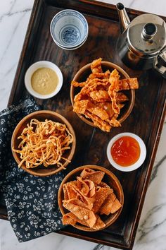 three wooden bowls filled with different types of food