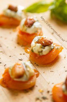 small appetizers are arranged on a cutting board