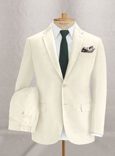 Celebrate the season in a graceful, yet sharp Light Beige Feather Cotton Canvas Stretch suit. Crafted from cotton lycra blend, the light beige suit is made from a breakthrough stretch fabric that moves with you and keeps its shape. Make it sharp with a matching waistcoat, white shirt, brown tie and dark brown shoes. 
 
 Look Includes  Light Beige Feather Cotton Canvas Stretch Fabric  Two Button Jacket Style  Notch Lapel   Corozo      Beige   Buttons  Single Vent  Three Cuff Buttons  Two Welted B Green Suit Men, Olive Green Suit, Red Tuxedo, Dark Brown Shoes, Herringbone Suit, Herringbone Tweed Jacket, Green Chinos, Stylish Men Wear, Tweed Pants