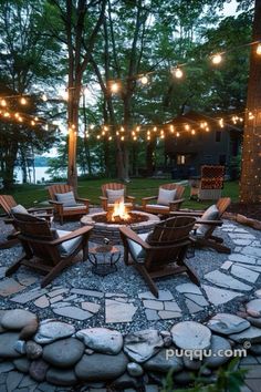 a fire pit surrounded by chairs and lights