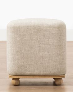 the footstool is made out of wood and fabric