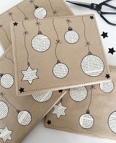 three pieces of brown paper with black and white ornaments on them