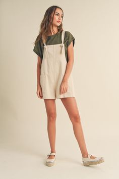 This "Harbor" romper flaunts effortless, relaxed style. Its tied sleeves and large pockets offer comfort and convenience. Crafted from lightweight, breathable fabric, it's sure to be your go-to piece for easygoing days. Shoe Gifts, Dress Jewelry, Relaxed Style, Sales Gifts, Baby Shop, Breathable Fabric, Jumpsuit, Rompers, Womens Tops