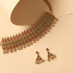 Buy Anila Floral Kempu Choker Set | Tarinika Gold Fusion Choker With Tilla, Festive Gold Choker With Meenakari Detail, Lakshmi Choker Gold, Festive Gold Meenakari Choker, Handmade Gold Bollywood Choker, Indian Jewelry, Floral Motif, Essence, Antique Gold