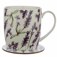 a coffee cup with purple flowers painted on it