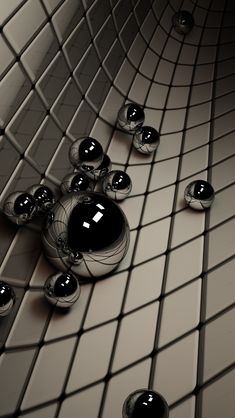 some balls are floating in the air on a tile floor