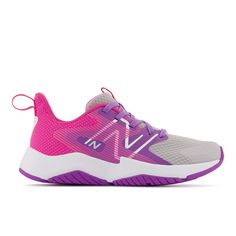 a women's new balance shoes in grey and pink with purple accents on the upper part