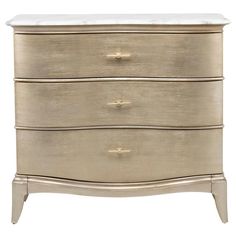 a white and gold dresser with three drawers