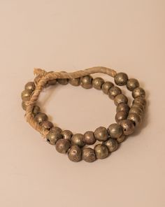 These brass African beads are beautifully textured, each individual bead unique in shape and finish for a final look that feels one-of-a-kind and natural. Perfect for layering on a vase, an open book, a bowl, or styling on a shelf. All Sales Final Free Shipping An Open Book, African Beads, Open Book, A Bowl, Layering, Vase, Brass, Bowl, Texture