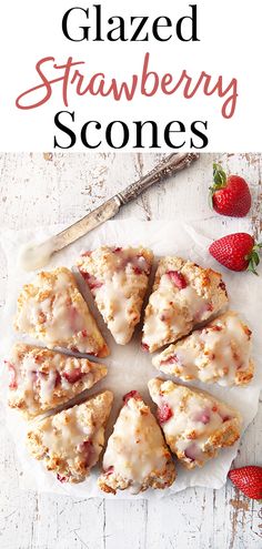 glazed strawberry scones on parchment paper with strawberries in the background and text overlay