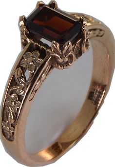 Vintage Garnet Birthstone Promise Ring, Elegant Hallmarked Garnet Birthstone Ring, Antique Garnet Promise Ring, Classic 14k Gold Brown Ring, Elegant Brown Rings For Formal Occasions, Classic Formal Burgundy Rings, Elegant Bronze Ring For Formal Occasions, Formal Brown 14k Gold Rings, Vintage Garnet Ruby Ring With Intricate Design