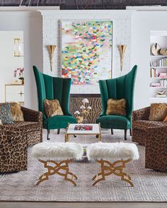 the living room is decorated in leopard print and blue velvet chairs with white fur on them