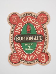 a sticker on the side of a wall that says, who coopes burton ale?