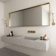 a bathroom with two sinks and a large mirror