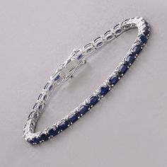 14k Gold Blue Sapphire Bracelet, Genuine Blue Sapphire Ovals Gold Bracelet for Women, Blue Sapphire Gold Tennis Bracelet, Gift for Her Celebrate the elegance of September with this luxurious 14K white gold tennis bracelet, featuring 7.48 carats of genuine oval blue sapphires. The deep blue sapphires, September's birthstone, are beautifully set in white gold, creating a striking and sophisticated piece. Designed with a secure box clasp, this bracelet offers both beauty and functionality. Perfect Luxury Blue Oval Diamond Bracelet, Formal Blue Oval Diamond Bracelet, Blue Oval Tennis Bracelet For Formal Occasions, Blue Jewelry With Jubilee Bracelet For Anniversary, Blue Oval Sapphire Diamond Bracelet, Blue Oval Sapphire Tennis Bracelet, Blue Sapphire Oval Tennis Bracelet, Blue Oval Diamond Bracelet With Jewels, Luxury Blue Sapphire Bracelets