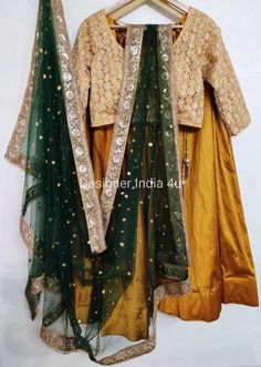 This is a made to order Lehenga Choli dupatta. I make it exclusively for my customers by using designer fabrics.I will only make it after you confirm your required size details.Handling time, don't worry, just tell me, I will process it accordingly and deliver on or before a delivery date you mention.Lehnga made with Tafta silk fabric.Blouse made with embroidered fabric.Dupatta is in Net with embroidery lace border on all sides of it. Dupatta is decorated with sequence work all over as shown in Semi-stitched Art Silk Lehenga With Self Design, Gold Raw Silk Lehenga With Self Design, Gold Self Design Raw Silk Lehenga, Designer Yellow Lehenga With Self Design, Gold Lehenga With Unstitched Blouse For Navratri, Yellow Designer Self Design Lehenga, Yellow Self Design Lehenga, Designer Yellow Self-design Lehenga, Chinon Lehenga With Dori Work For Navratri