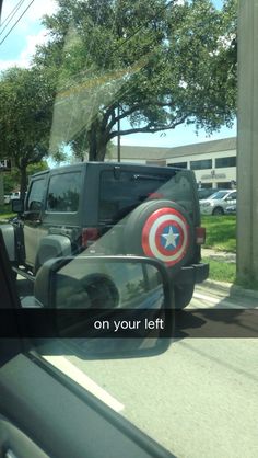 the captain's shield is reflected in the rear view mirror