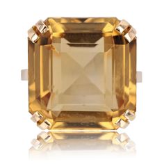 Ring in 18 karat yellow gold, eagle head hallmark. Important retro ring, it is set with 4 x 2 claws of a degrees- cut citrine. The basket is openwork. Weight of the citrine : 18 carats approximately. Height : 17 mm, width : 16.2 mm, thickness : 13 mm, width of the ring at the base : 1.9 mm. Total weight of the jewel : 9,6 g approximately. US Size : 5,75 ; Free resize, please contact us. Authentic antique jewel - French work from the 1950s. Our opinion : A beautiful antique citrine ring, well in Yellow Gold Cocktail Ring, Gold Eagle, Retro Ring, Gold Cocktail Ring, Gold Cocktail, Eagle Head, Citrine Ring, Champagne Gold, Emerald Diamond