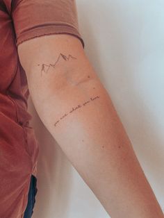 a woman with a tattoo on her arm that reads, i love you to the moon and back