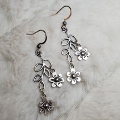 Leaf Branch With Tiny Flowers Earrings. Branch Charms Are Approximately 12x25mm. Comes On Stainless Steel Fish Hook Earrings. #Leaf #Flowers #Boho #Silver #Earrings Halloween Earrings Beaded, Boho Silver Earrings, Apple Earrings, Boho Hoop Earrings, Flowers Earrings, Bunny Earrings, Ghost Earrings, Earring Ideas, Fish Hook Earrings