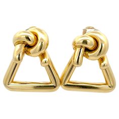 Estate Cartier Triangle Knot Earrings in 18K Yellow Gold. The earrings measure 1.5" by 1.25" and weigh 43 grams. Gold Triangle, Luxury Earrings, Knot Earrings, Cartier, Clip On Earrings, Jewelry Earrings, Yellow Gold, Yellow, For Sale