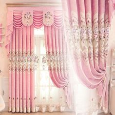 the curtains in this room are pink with white trimmings and flowers on them