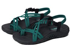 SKECHERS Reggae - Irie Mon - Women's Shoes : Black/Teal : The SKECHERS Reggae - Irie Mon sandal boasts comfort and eye-catching style with a river-style design, woven straps, and an open toe. Stretch fabric upper material. Quick-access buckle closure at the ankle. Adjustable side tab offers a custom fit. Breathable fabric strap lining. Contoured and cushioned insole lends to all-day comfort. Shock-absorbing midsole. Flexible rubber traction outsole. Imported. Measurements: Weight: 8 oz Product m Summer Sport Sandals With Adjustable Strap, Comfortable Sport Sandals With Buckle Closure For Vacation, Adjustable Green Sport Sandals With Removable Insole, Green Casual Sport Sandals With Adjustable Strap, Casual Green Sport Sandals With Adjustable Strap, Toe Loop Slingback Sandals For Beach, Summer Sandals With Single Toe Strap For Outdoor, Toe Loop Strap Sandals For Vacation, Vacation Toe Loop Strap Sandals