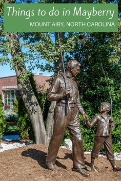 a statue of a man holding the hand of a young boy