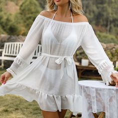 Step into summer with elegance and style with our Chic Net Yarn Tassel Beach Dress Cover-Up. Perfect for the fashion-forward woman, this cover-up combines comfort, style, and functionality, making it an essential for any beach day or poolside relaxation. Key Features Material: Crafted from high-quality acrylic, ensuring a lightweight and breathable feel. Pattern: Elegant solid design that offers a chic and timeless look. Style: Designed in an 'Office Lady' elegant fashion style, this cover-up is Chic Tunic Cover-up For Beach Season, Chic Mini Length Cover-up For Vacation, Beachy Mini Length Cover-up For Beach Party, Beachy Sundress For Spring Beach Cover-up, Spring Beach Cover-up Dress With Tassels, Chic Mini Beach Dress For Summer Outings, Beachy Mini Length Cover-up For Vacation, Beachy Mini-length Cover-up For Vacation, Beachy Mini Cover-up For Vacation