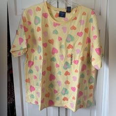 This Mountain Lake Short Sleeve Tee Is 60% Cotton And 40% Polyester. It Has A Crew Neck And Orange, Pink And Green Hearts. It Is A Size Xl And New With Tags. Never Worn. Excellent Condition. Smoke Free Home. Casual Heart Graphic Top For Loungewear, Heart Graphic Relaxed Fit Top For Loungewear, Relaxed Fit Heart Graphic Top For Loungewear, Relaxed Fit Loungewear Tops With Heart Graphic, Cute Tops With Heart Print For Loungewear, Cute Heart Print Tops For Loungewear, Relaxed Fit Heart Print Tops For Spring, Spring Tops With Heart Print And Relaxed Fit, Heart Print Tops With Relaxed Fit For Spring