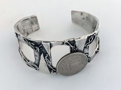 "Artisan Hand Made Sterling Silver Brutalist Cutout Cuff. Unique mix of polished and oxidized sterling silver accented with geometric and free form patterns. Lightly cleaned ready to wear. Will Fit Wrists Up To 6 3/4\" Markings: Unmarked, Acid tested and sterling silver. Measurements: Approx 6 3/4 inch total inside circumference including wrist opening, 2 3/8 inch inside diameter, 1 1/8 inch wrist opening and 1 3/4\" wide at front center. Total Weight: 40.5 grams Condition: Good Vintage Conditio Artisan Oxidized Finish Cuff Bangle Bracelet, Artisan Oxidized Bangle Cuff Bracelet, Unique Oxidized Finish Cuff Bangle, Unique Oxidized Cuff Bracelet Bangle, Silver Cuff Bracelet With Stamped Details, Unique Silver Stamped Cuff Bracelet, Stamped Sterling Silver Cuff Bracelet, Unique Oxidized Finish Cuff Bracelet As Gift, Unique Oxidized Finish Cuff Bracelet For Gift