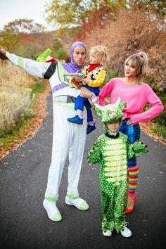 a man and two children are dressed up as toy story characters, including buzz lightyear