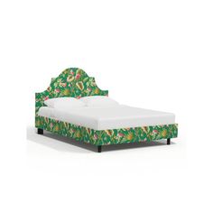 a green bed with floral headboard and foot board on the bottom, in front of a white background