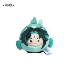 an image of a stuffed animal with green hair and horns on it's head